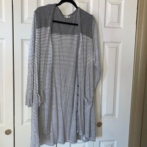 Maurice’s long cardigan.